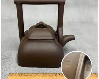 Closer view of Chinese Yixing Zisha clay teapot of square shape with overhead handle, archaic water chestnut shape. Wang Hongfen mark to the interior of the cover and to the base