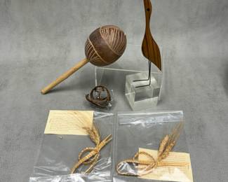A traditional hand-carved gourd maraca or rattle; two "corn dollies" friendship favors woven from the stems and heads of wheat; something that could possibly be a coiled up snakeskin; and a Mid-century Jacob Hermann Zebrawood bird sculpture, Denmark 1950s