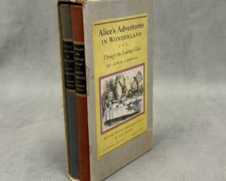 a vintage two-volume boxed set of Alice's Adventures in Wonderland and Through the Looking-Glass by Lewis Carroll, published by Random House in 1946 with John Tenniel's classic illustrations colored by Fritz Kredel
