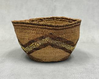 An old Klamath Tribes / Maklaks hand-woven, twined basket or basket hat with dark browns and yellow/cream overlay in geometric mountain peak motif;  7"W x 4"H