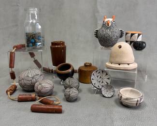 A selection of Southwestern Native American ceramic beads, small seed jars, bowls, and jars; including a Zuni pottery owl 