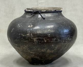Antique dark-glazed earthenware or terracotta storage vessel featuring a bulbous body and a wide rounded shoulder; approximately 11 inches tall