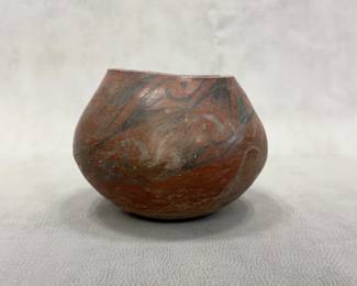 A prehistoric Casas Grandes black on red pottery olla or jar, approximately 8 inches wide