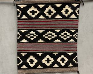 Southwestern Navajo-style third-phase chief blanket or revival rug, featuring geometric stepped diamond motifs in black, ivory, gray, and red bands; 28" x 33"
