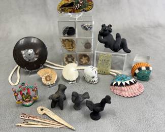 Bone awl and needles; Native American miniature woven baskets and bowls; a Santa Clara blackware clay Mudhead figure by Paul & Dorothy Gutierrez, Santa Clara Pueblo; polished ammonite fossil specimens; a Native American child’s beaded hide sinew-sewn moccasin