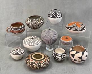 An antique Native American pueblo pottery cup with handle, a Hopi-Tewa open seed jar w/classic negative Migration or Birdwing design by Fannie Nampeyo (Native American, Hopi-Tewa, 1900–1987) (see similar Nampeyo seed jar in the Metropolitan Museum, NY); a selection of vividly decorated Acoma Pueblo seed jars and ollas by artists including Lucy Lewis, C. Chino, Rose Garcia, A. Roy, and B. Ramirez