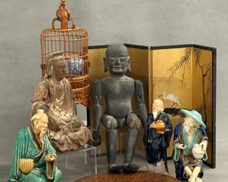 Three vintage Chinese mud man figurines; a carved wooden buddha statue; an antique wooden articulated Asian devotional figure or temple sculpture with pegged joints allowing the arms and legs to move; a small 4-panel Asian gilded screen with landscape and heron decoration; a vintage, handcrafted Asian bamboo and wood songbird cage; and an antique Chinese hardwood Loupan Feng Shui geomantic compass, completely decorated with Chinese ideograms on both the front and back using hand-inscribed calligraphy 