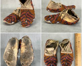 Pair of antique Native American Indian beaded moccasins, sinew-sewn with extensive beadwork in geometric pattern of amber, dark blue, pink, and white; integrated leather tie laces through the cuff fold.