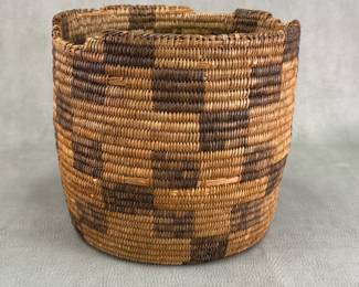 An Indigenous Native American Pima Akimel O'odham coil-woven cylindrical form basket with checked geometric pattern, pre-WWII; approximately 8-1/2" tall.