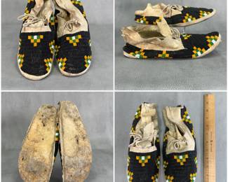 More views of the pair of Native American beaded hide moccasins—likely 19th-century Lakota Sioux or Northern Plains origin—with sinew-sewn tanned hide and intricate beadwork of predominantly black vamp fields accented with distinctive geometric stepped or checkerboard beadwork in black, green, yellow, and white