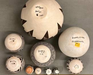 Another view of the Southwestern Native American pottery from the Acoma Pueblo artisans, including large seed jars with dynamic geometric decorations by Gilbert Chino and Elizabeth Wakonda; hand-coiled local clay storage jars or ollas painted in white slip with black geometric patterns by Pablita Concho, Lucy M. Lewis, and V. Victorino. 