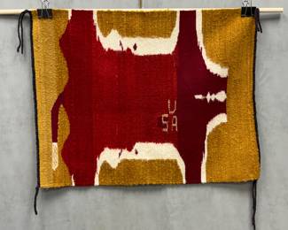  Diné (Navajo) hand-woven stylized cow hide pictorial rug with "USA" lettering and braided edges; mid-20th century, 24"W x 31"H 