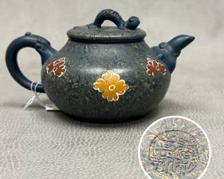 A vintage blue and tan marbled Yixing Zisha teapot featuring colorful floral mud-painting motifs and an sculpted lizard crawling on the lid