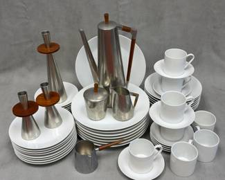 A vintage mid-century modern Royal Holland KMD Tiel (Daalderop) Dutch pewter and teak coffee service set featuring sleek tapered bodies and contrasting wooden accents; a large set of mid-century modern Fairwood-Schonwald white dinnerware plates, saucers, and coffee cups, made in Germany; and three pewter and wood candle stick holders by Royal Holland KMD Tiel