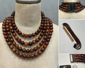 A dramatic designer necklace: Gerda Lynggaard for Monies four strand horn statement necklace – rows of rich natural horn beads are gathered with an iconic natural horn closure. By husband and wife team Gerda Lynggaard & Nikolai Monies of Copenhagen, Denmark