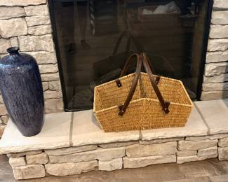 structured, hand-woven wicker market basket features durable leather handles attached with metal studs and set of large blue vases