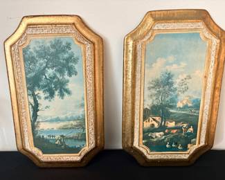vintage Italian Florentine-style wall plaques featuring pastoral landscape prints within ornate gold gilt and white frames