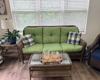 Jeco 6 Piece Wicker Seating Set features sage green cushions and brown woven synthetic resin construction & matching coffee Table