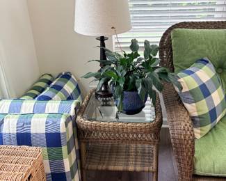 Jeco wicker patio coffee table featuring a traditional lattice weave and an inset glass top