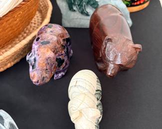 crystal bear carving, potentially made from materials like Mookaite or Rhodonite