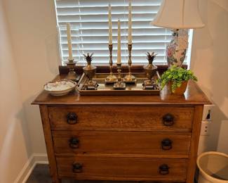 antique oak chest of drawers features a classic three-drawer design with traditional brass ring pulls