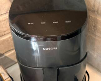 Cosori Lite 2.1 Qt Small Air Fryer in gray, featuring a 4-in-1 design for baking, roasting, and reheating