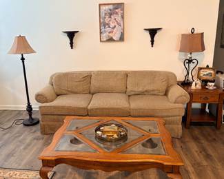 traditional tan striped three-seater sofa featuring comfortable rolled arms