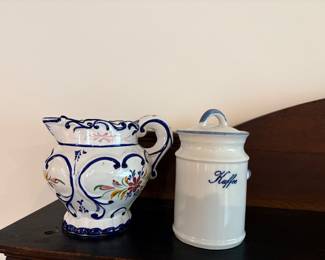 vintage Portuguese pottery pitcher often featuring a distinct blue and white floral motif.& vintage white porcelain canister features a blue script label reading "Kaffee".It belongs to a style of kitchen storage similar to Blue & White Danish or German ceramic designs.
