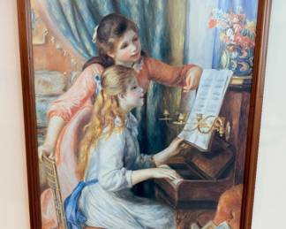 framed art print features the oil painting "Two Young Girls at the Piano" by French Impressionist artist Pierre-Auguste Renoir, originally completed in 1892