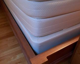 Two very clean twin mattresses that make up the king