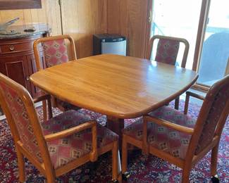 Table and chairs with two leaves