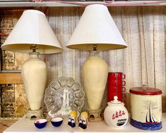 Vintage stone-like finish lamps, glass egg tray, vintage kitchen jar, metal sailboat tin, cups w/ stand, figural napkin holders, enamel creamer/sugar