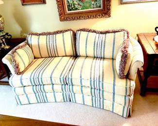 Delightful striped loveseat with fringe trim