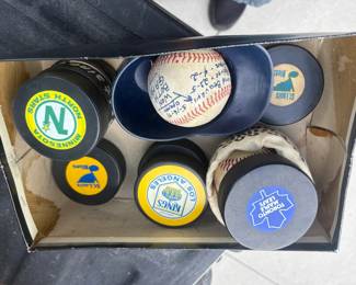 . . . vintage team-logo hockey pucks