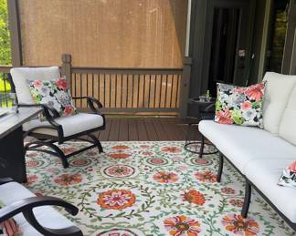 PRESALE $150 RUG-The Santa Monica  Floral Indoor & Outdoor Area Rug (8x10) features a striking, multi-colored oversized botanical pattern. It is sold by the home decor retailer At Home.Product SpecificationsDesign & Colors: Features an oversized floral pattern with bright shades of color. Built with a durable, stain-resistant, and mold-resistant synthetic flatweave construction.Placement: Engineered for both indoor and high-traffic outdoor spaces like patios, decks, or porches.Care Instructions: Clean easily by sweeping, vacuuming, or hosing it down with mild soap and water(PATIO FURNITURE SOLD)