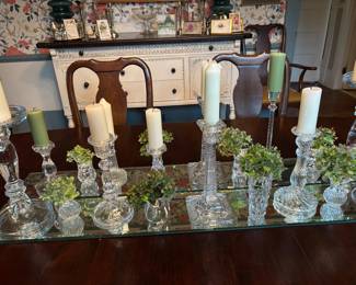 Lots of glass candlesticks and vases