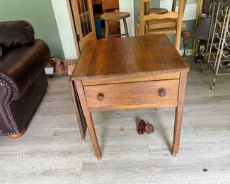 One drop leaf table with drawer