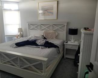 King bedroom suite: king bed; nightstands; table lamps; dresser with mirror