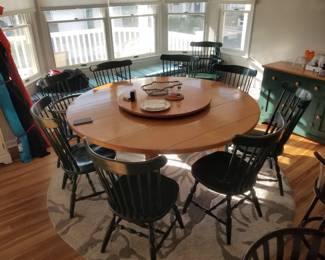 Round table with attached lazy Susan seats 8. 8 side chairs & 2 arm chairs available