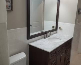 Updated bath vanity; mirror; vanity lights