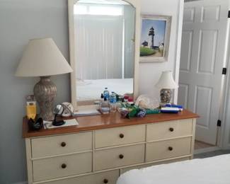 Dresser with mirror; table lamp