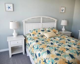 Queen bedroom suite: queen bed; nightstands; table lamps; dresser with mirror