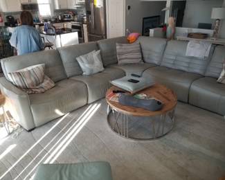 Large sectional sofa; coffee table; area rug