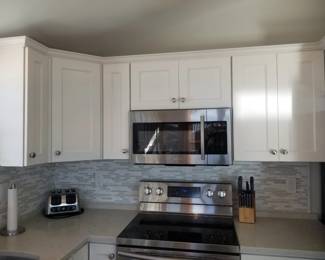 Kitchen cabinetry detail; Samsung microwave oven