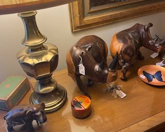 Bronze elephant and carved rhinos