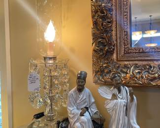 One of a pair of cut crystal buffet lamps with prisms and oriental mud figures
