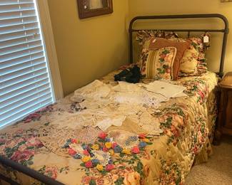One of two twin iron beds