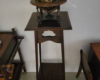 Plant stand and wooden globe