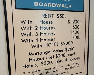 Framed wall art of Monopoly Boardwalk title deed card