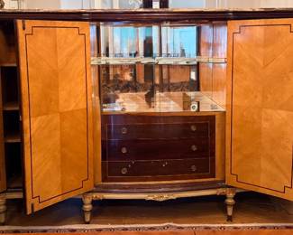 Mahogany with marquetry bar. The photos dont do it justice. It's magnificent.